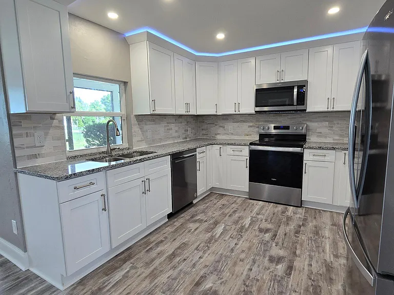 All new kitchen with granite and stainless appliances.
