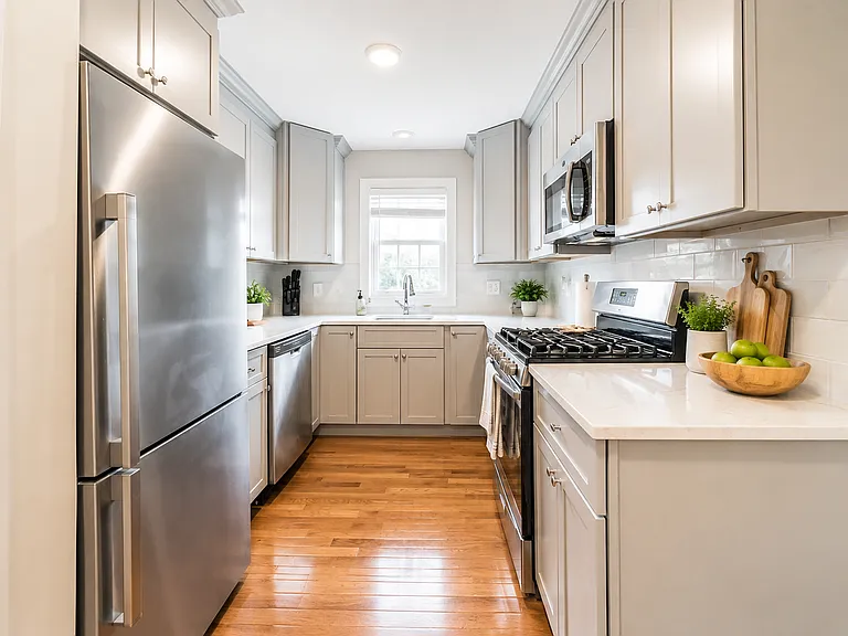 Updated kitchen with stainless-steel appliances and generous cabinet space