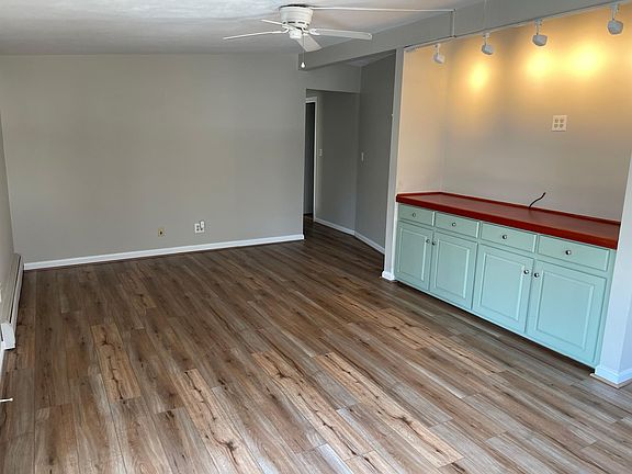 Entry opens into living room. NEW flooring.