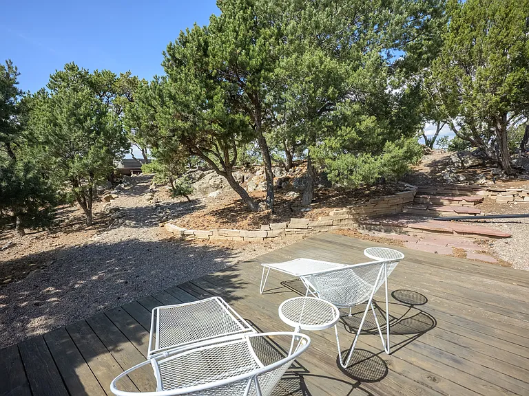 Master bedroom private patio with short walk up pebble path to the hot tub deck