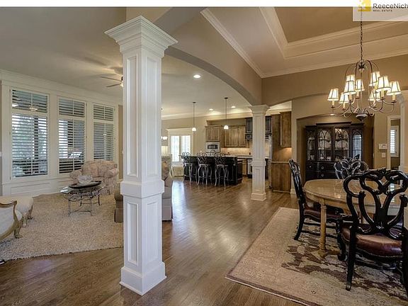 WARM COLORS AND PLANTATION SHUTTERS THROUGHOUT THE FIRST FLOOR