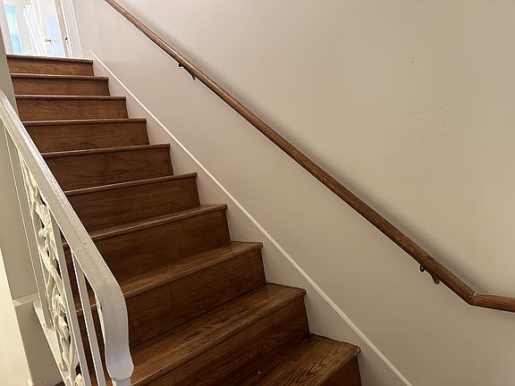 Just inside the Front Door to the right You'll find Bedrooms 5 and 6 at the top of the stairs along w/ the Upstairs Bathroom