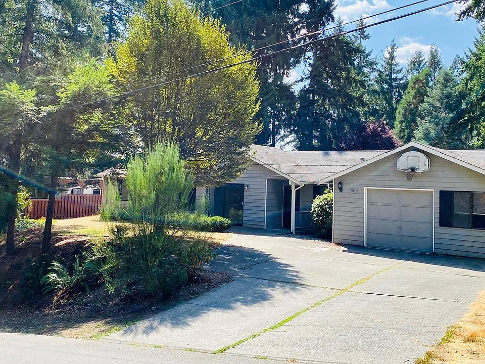 Large driveway for parking, attached garage with extra storage