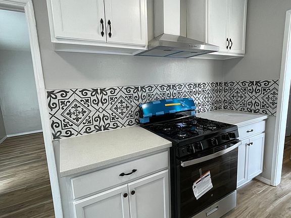 Renovated kitchen with new stove and vent