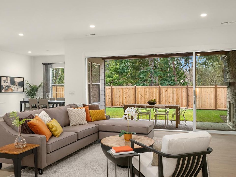 Great room with expansive stacking glass doors to covered patio