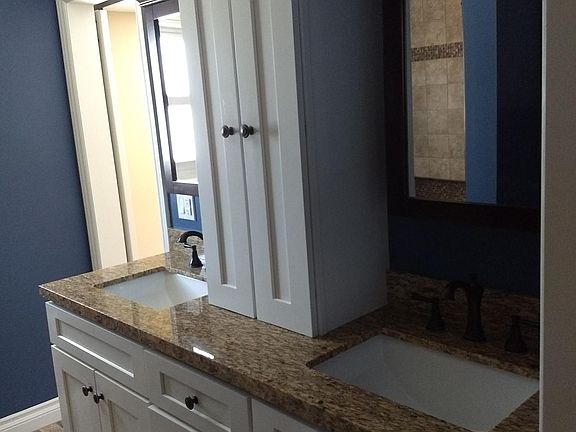 Double vanity in the main bathroom with plenty of storage space.