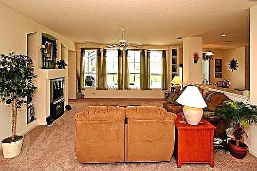 Family Room Windows Look Out Over the Sparkling Pool!
