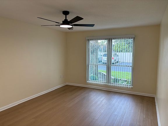 Living Room faces west and front window; new remote fan with LED light