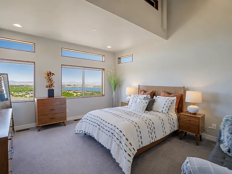 Master Suite with views of lake and granite mountain, large Walk in Closet and Master Bathroom with heated floors. Bed is Queen Size Adjustable bed with leg/knee lift, head lift and massager. dual heating bed cover each sleeper can control for comfort.