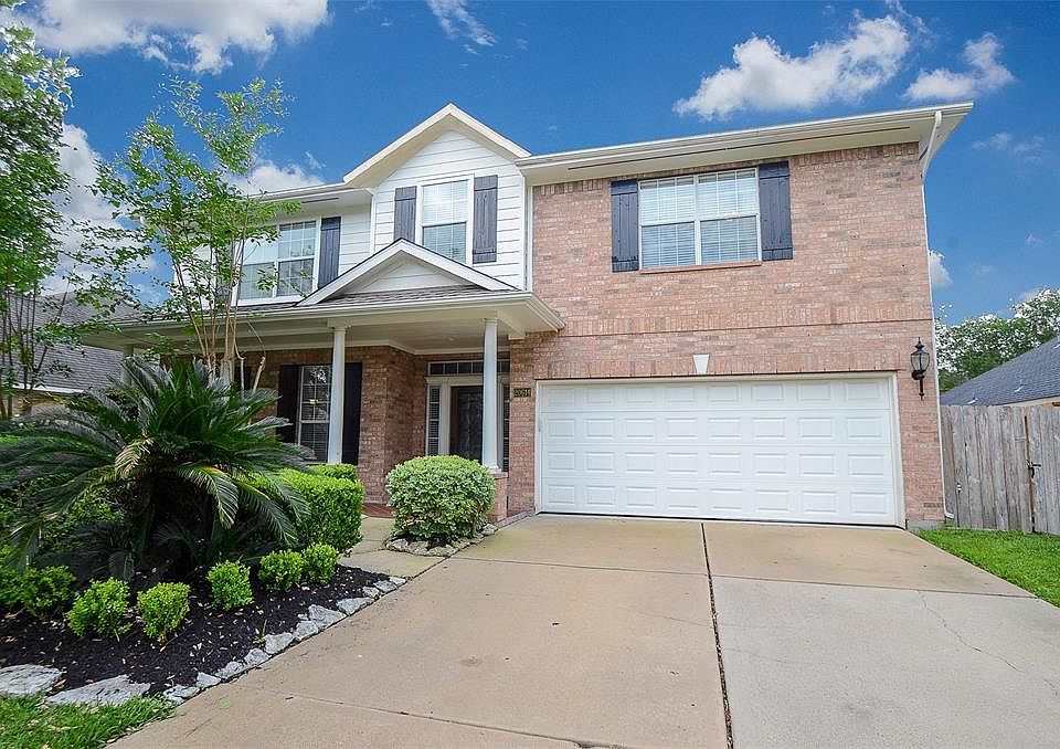 You will fall in love with this warm brick home with mature landscaping. Notice the beautiful double driveway.