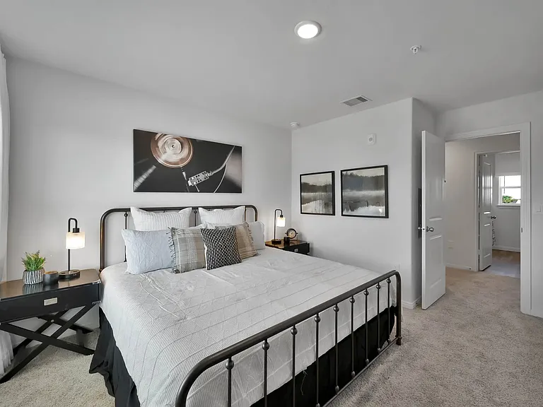 Discover serene living at Esperanza at Wild Orchid. This beautifully designed bedroom offers comfort and style, featuring modern decor and ample natural light. Experience a welcoming sanctuary today. Schedule your visit now!