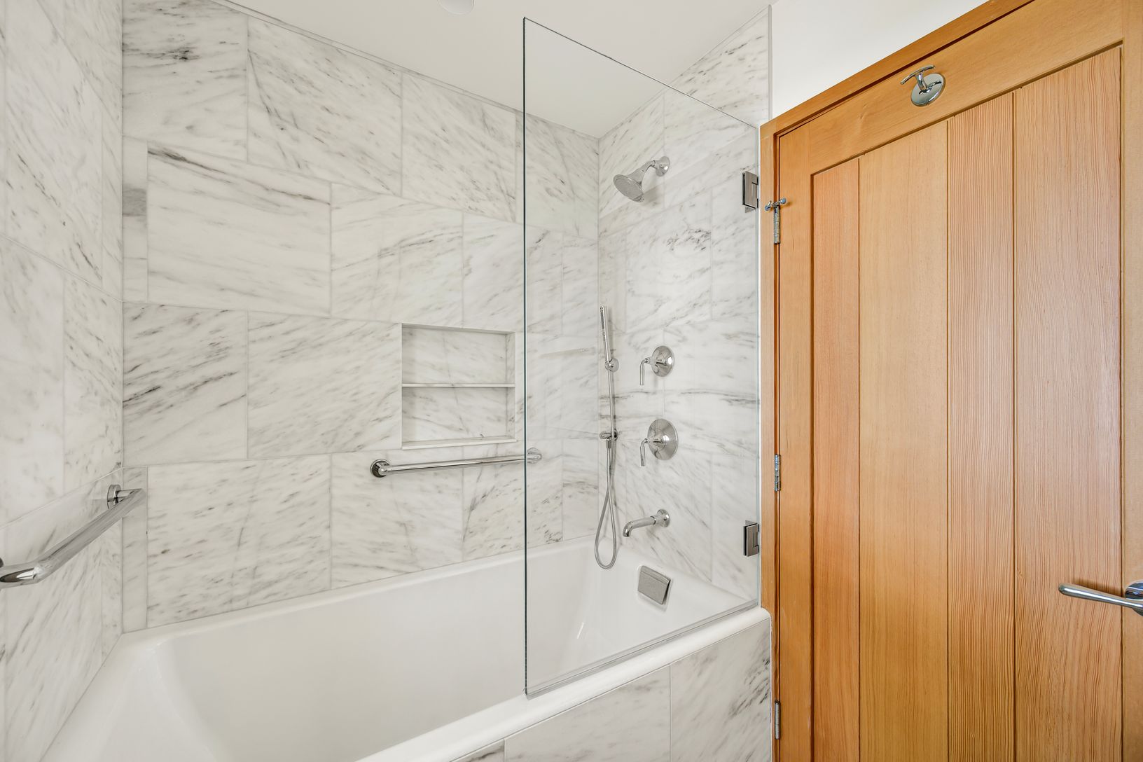  Primary bath with tub/shower and marble tiles