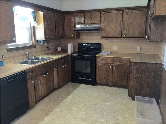Kitchen that overlooks the backyard, shop and over an acre of land.
