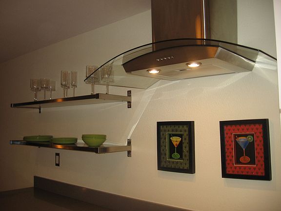 Contemporary S/S & glass range hood.