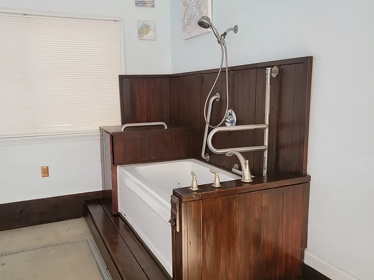 Tenant-use bathtub and shower (located in pool room)