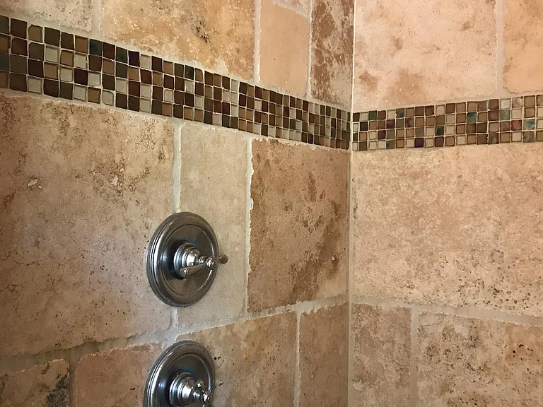 master shower with rain shower head and regular