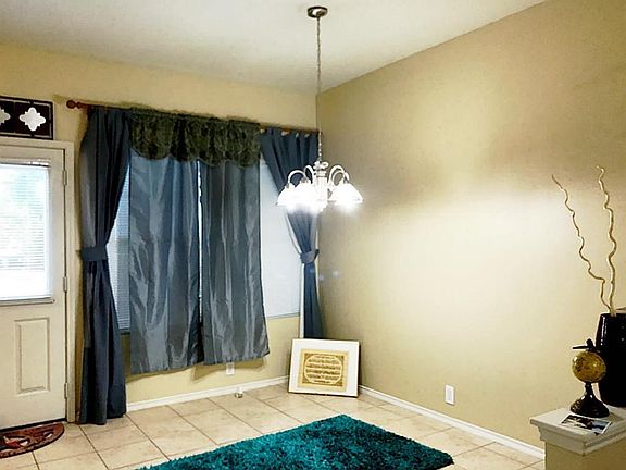 Dedicated dining area overlooking backyard & patio