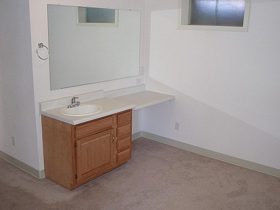 This is the sink and counter top next to the bathroom