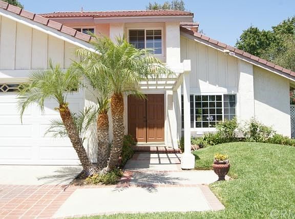 Welcome home to 24941 Avenida Bacal with elegant double door entry.