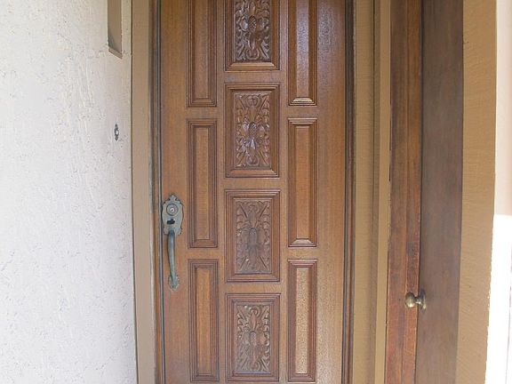 Carved wood front entry