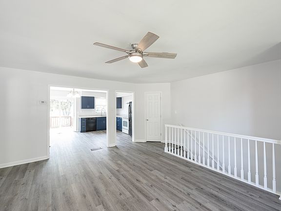 Living room area opens to kitchen