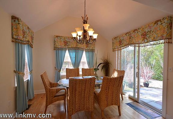 Sun filled Dining area with sliders to patio area