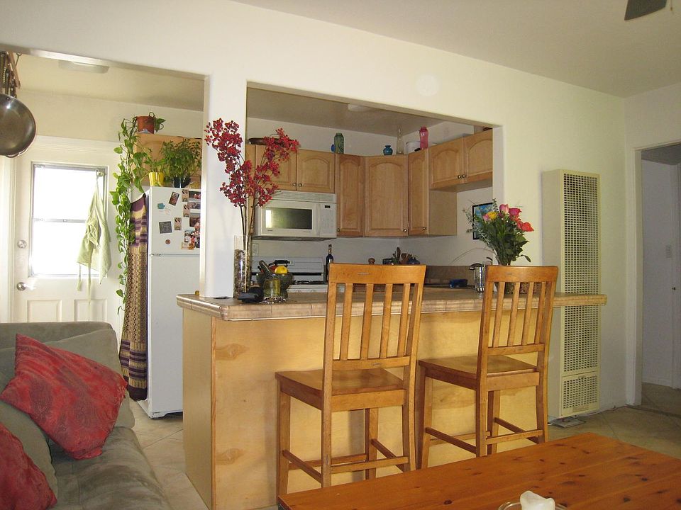 See upgraded microwave and range in the following photos.