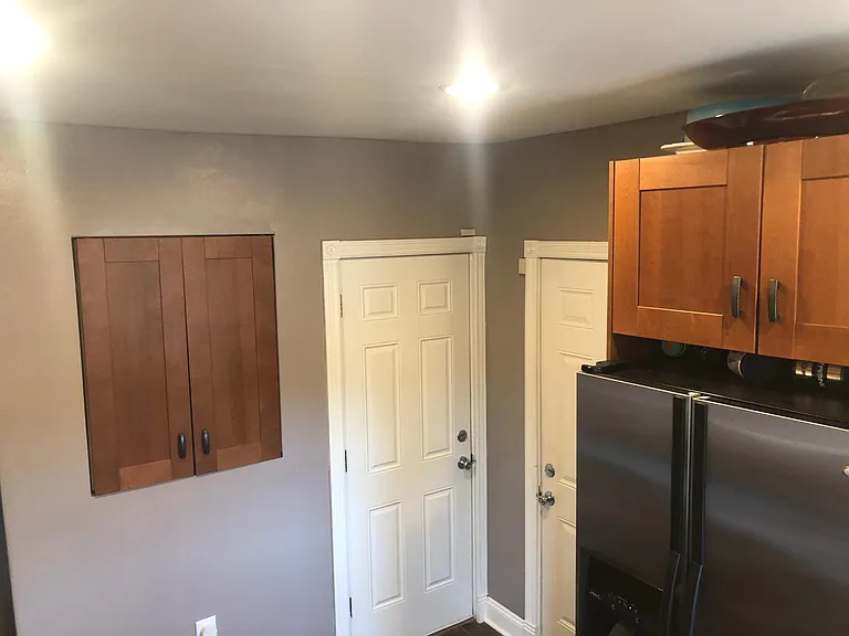 Kitchen and doors to basement and deck