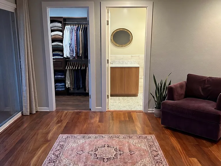 Master bedroom view to walk in closet and en suite bathroom