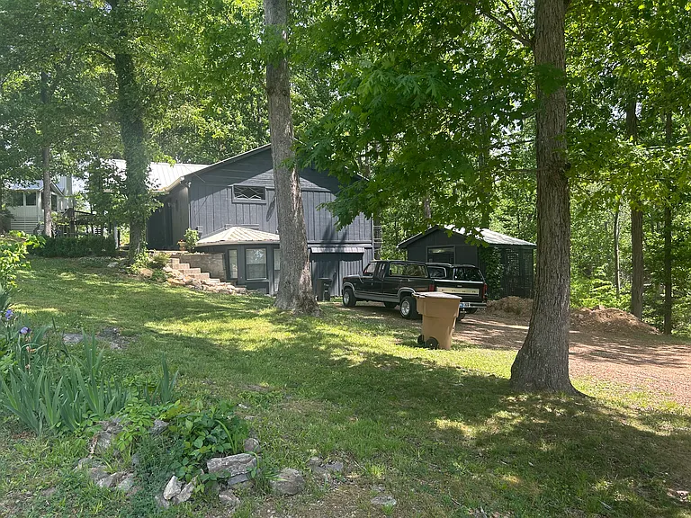 Large driveway affording parking for multiple cars and R.V.