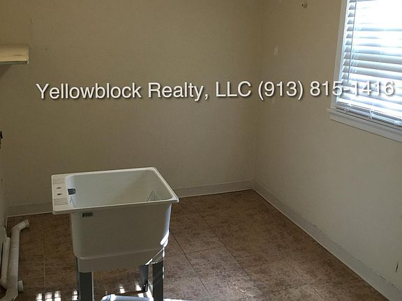 Utility/mud room with laundry hook-ups. Between garage and kitchen