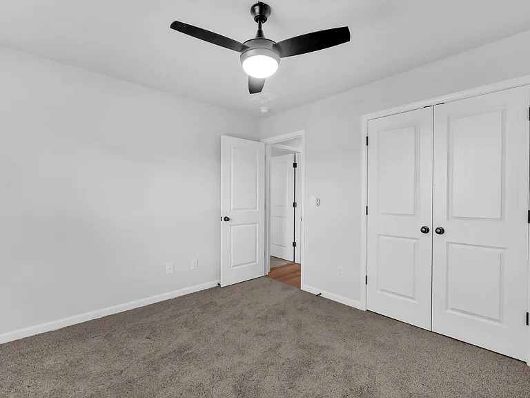 Another view of the third bedroom complete with closet