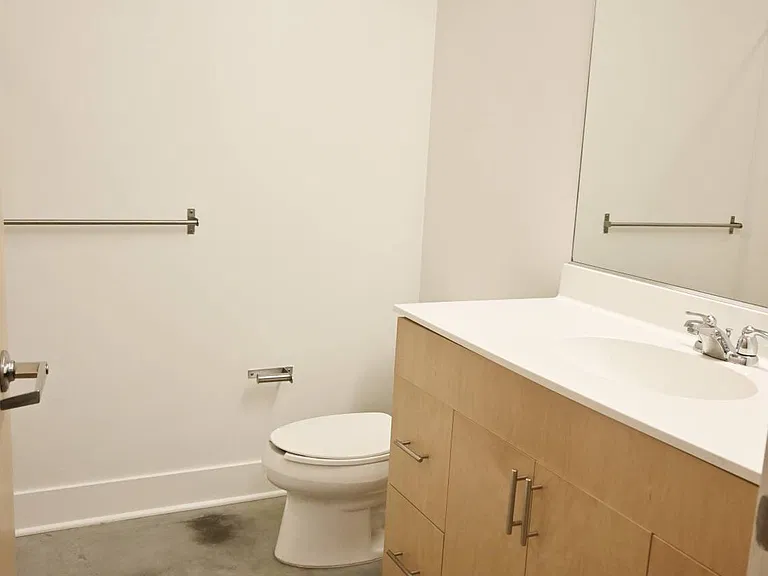 Bathroom with white walls at The Sawyer.