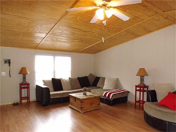 Love the ceilings and floors in this family room