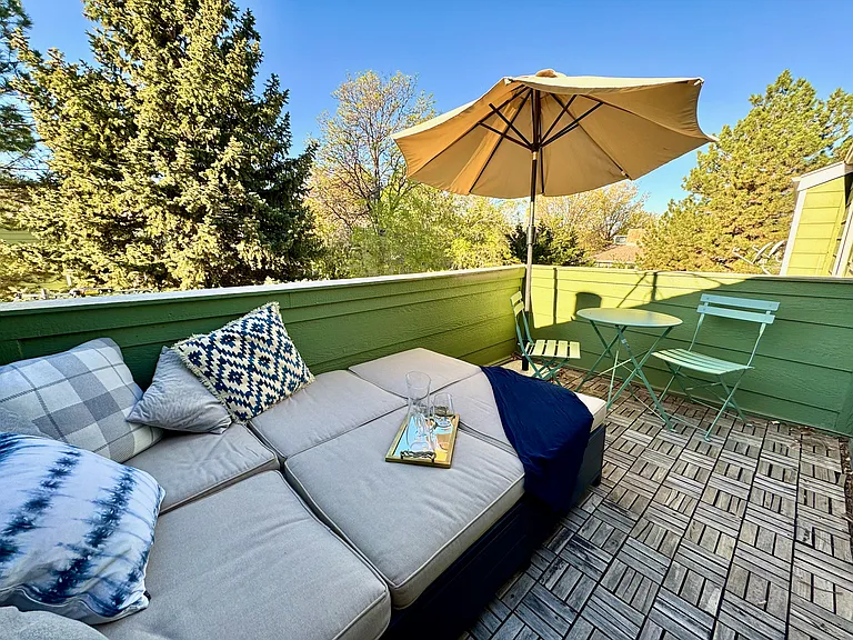 Balcony with bistro set and umbrella