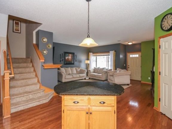 Open airy floor plan, kitchen overlooks the living and dining room.