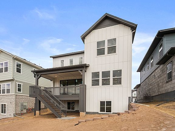 Rear exterior with covered deck and back yard