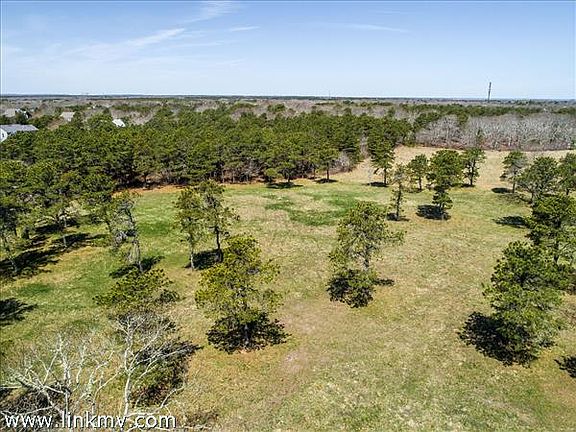 Acres of conservation land abut the property.