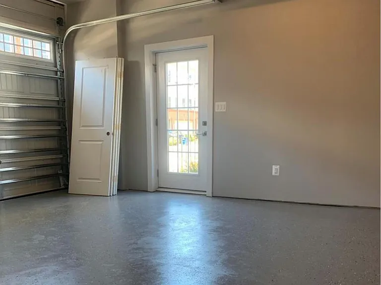 Two car garage with a side door