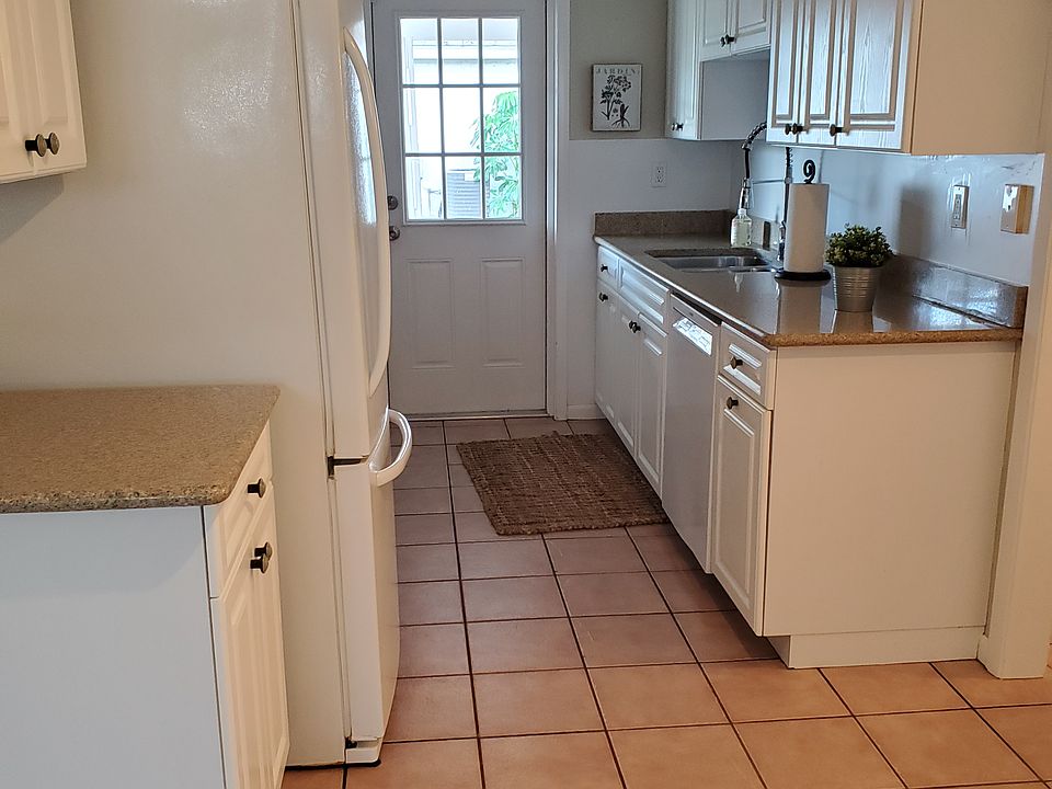 Galley kitchen off of the carport.