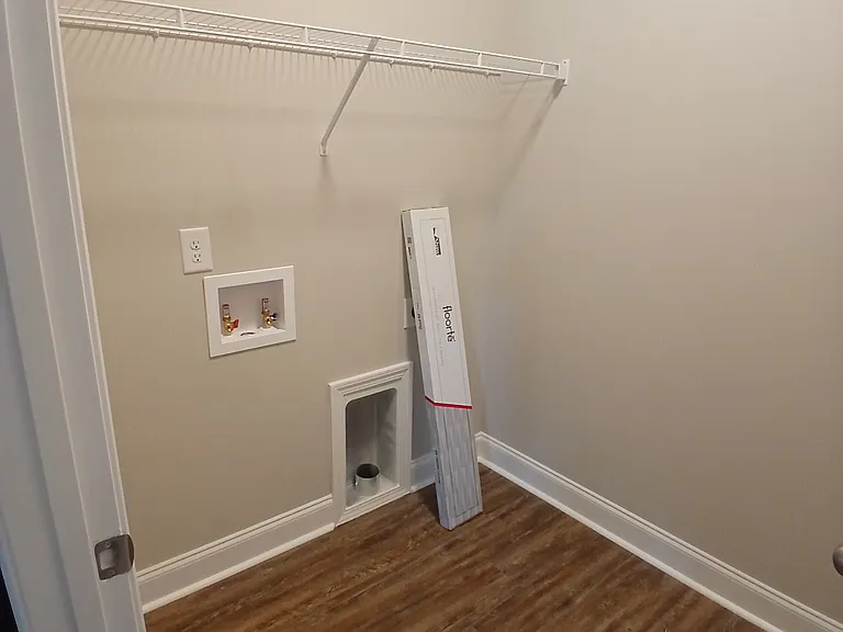 Separate laundry room away from kitchen with full size connections!