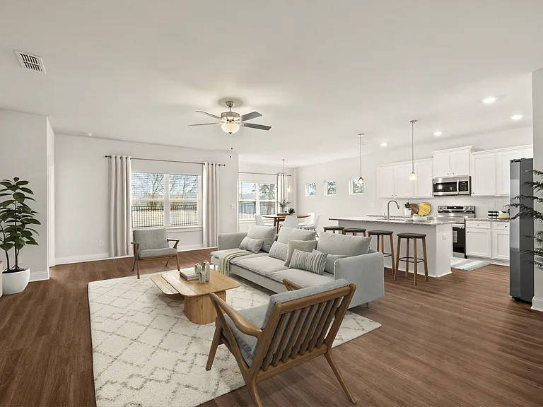 Living room with large window letting in a ton of natural light.