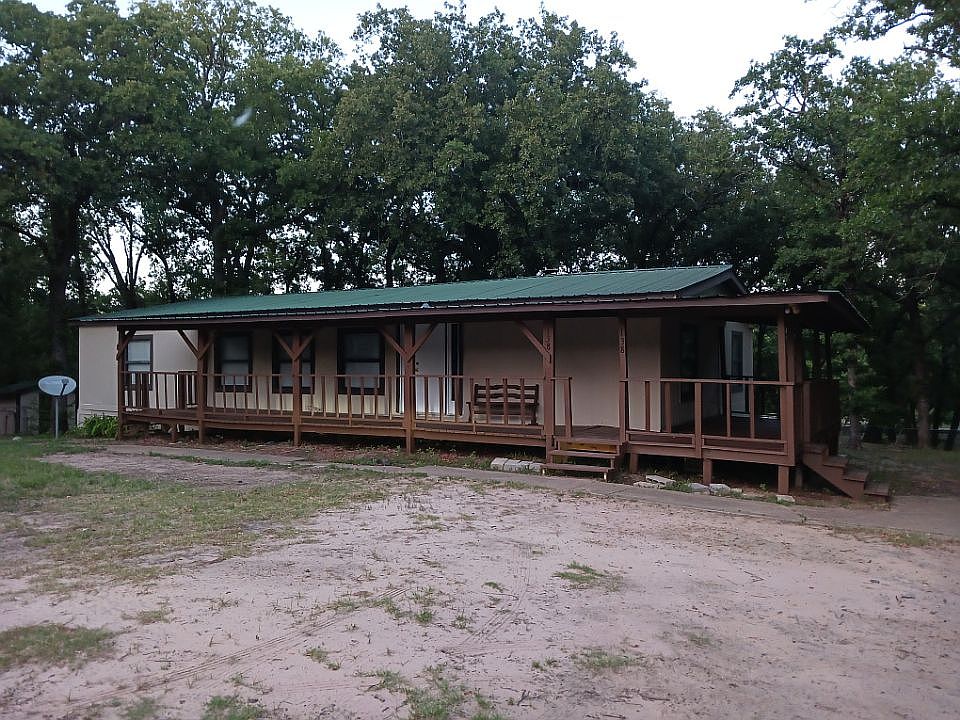 Front of home, large covered