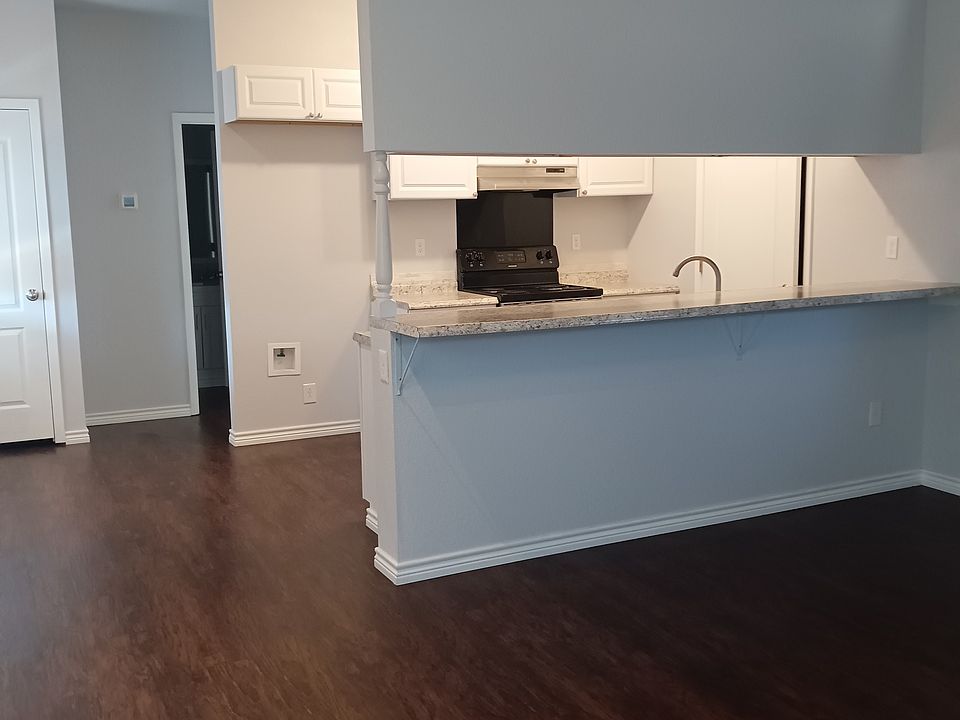 View into kitchen from living area.