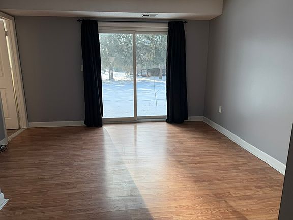 Sunny bedroom with attached bathroom, closet, and direct access to the patio.