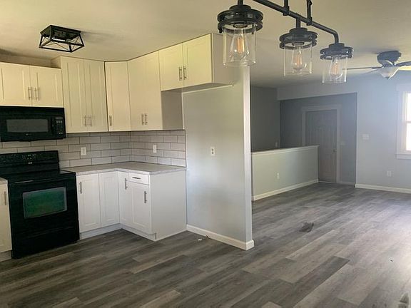 Kitchen looking into living room.