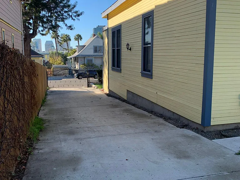 Gated parking for up to four vehicles. Comfortably park two next to each others at the end of the driveway.