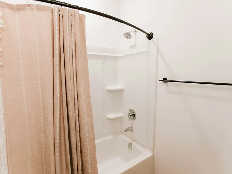 Soak, shower, repeat. Our clean, modern bathroom has all the essentials with a stylish touch.