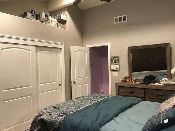 Large First Bedroom (#1) - with storage space above closet