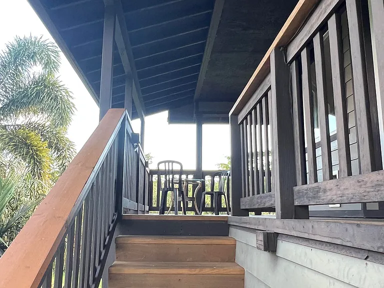 Staircase to upstairs entryway and lanai